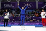 Speed Skating - Pyeongchang 2018 Winter Olympics - Men's 500m competition finals - Gangneung Oval - Gangneung, South Korea - February 19, 2018 - Havard Lorentzen of Norway celebrates a on the podium after winning a gold medal. REUTERS/Phil Noble