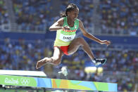 <p>Etenesh Diro of Ethiopia continues to compete after losing a shoe during the women’s 3000m steeplechase at Olympic Stadium in Rio on August 13, 2016. (REUTERS/Lucy Nicholson) </p>