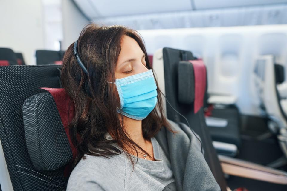 When passengers don't arrive with masks, airlines often hand out surgical masks like the one in this photo.