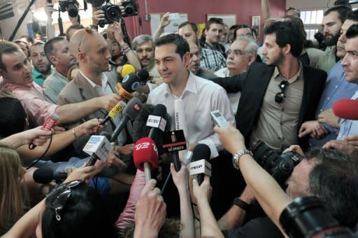 Radical left party leader, Alexis Tsipras makes statement to the Greek and foreign media after casting his vote at a polling station in Athens. Greeks angered by austerity took to the polls on Sunday for an election that could decide their future in the euro amid unprecedented external pressure not to vote for a radical leftist party