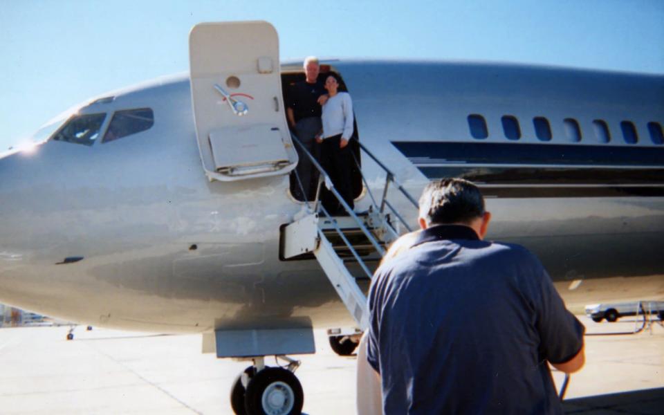 Bill Clinton and Ghislaine Maxwell pose together for the camera as the pair prepare to board Jeffrey Epstein's notorious private jet - The Mega Agency/CDWES