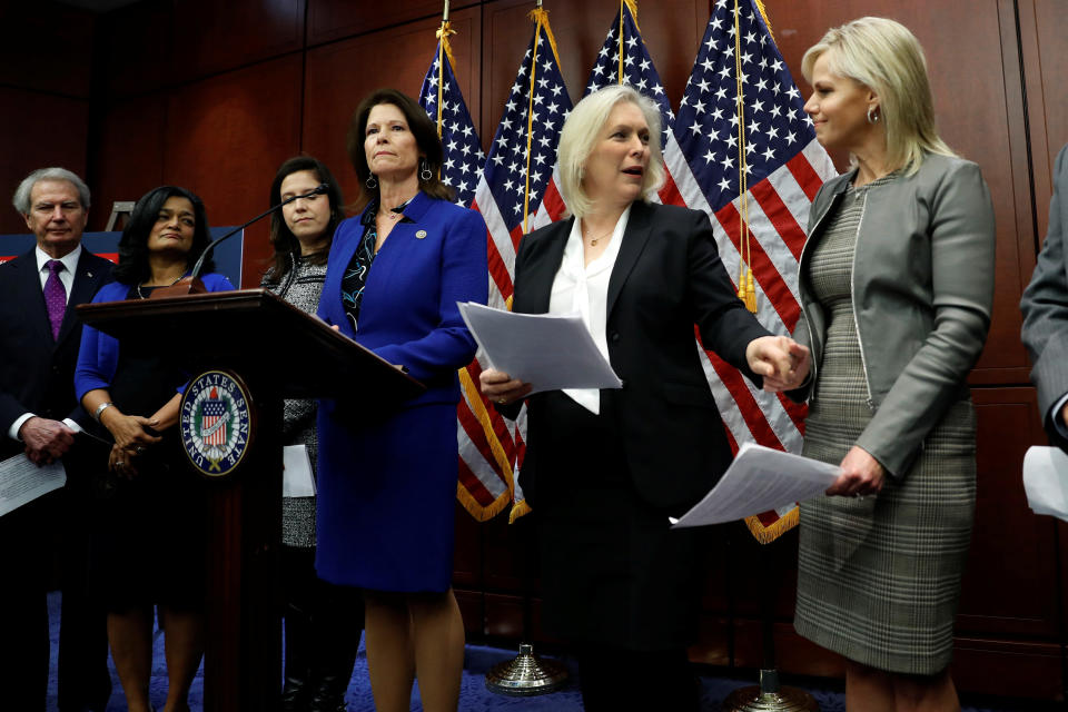 Rep. Cheri Bustos (D-Ill.) speaks at a press conference calling for an end to forced arbitration as Sen. Kirsten Gillibrand (D-N.Y.) greets Gretchen Carlson on Capitol Hill on Dec. 6, 2017. (Photo: Aaron Bernstein / Reuters)