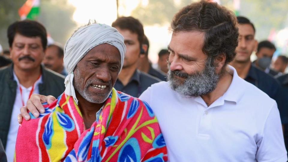 Rahul Gandhi with a citizen during the march