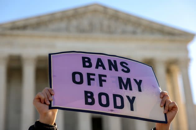 A pro-choice demonstrator holds a sign outside the U.S. Supreme Court on Nov. 1, 2021, as the justices hear arguments over a challenge to a Texas law that bans abortion after six weeks. (Photo: Evelyn Hockstein via Reuters)