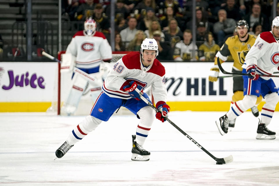 Montreal Canadiens left wing Rafael Harvey-Pinard (49) skates with the puck during the first period of an NHL hockey game against the Vegas Golden Knights, Sunday, March 5, 2023, in Las Vegas. (AP Photo/Lucas Peltier)