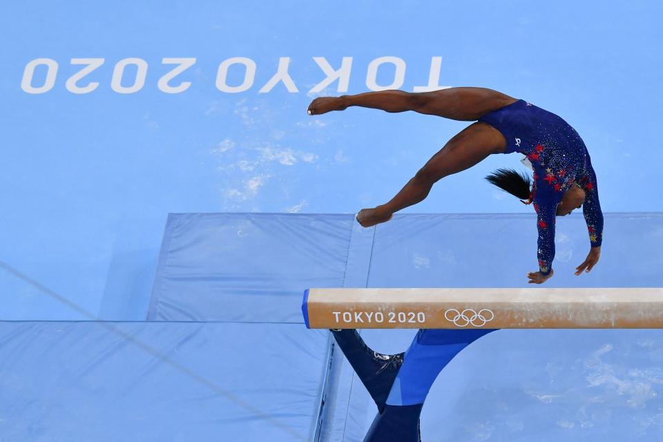 USA's Simone Biles competes in the artistic gymnastics balance beam event of the women's qualification during the Tokyo 2020 Olympic Games at the Ariake Gymnastics Centre in Tokyo on July 25, 2021.