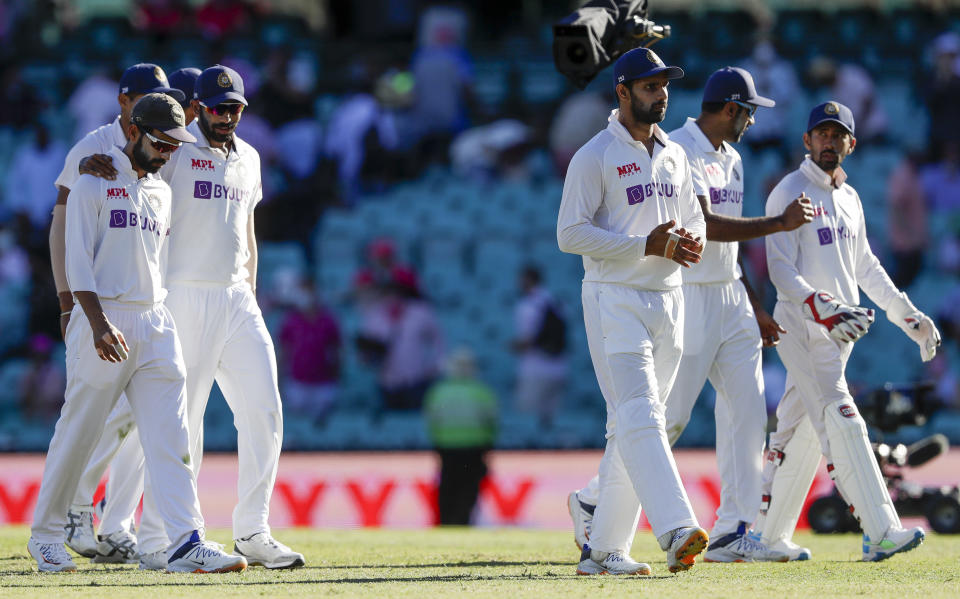 Indian players walk from the field at the close of play on day three of the third cricket test between India and Australia at the Sydney Cricket Ground, Sydney, Australia, Saturday, Jan. 9, 2021. (AP Photo/Rick Rycroft)