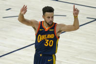 Golden State Warriors guard Stephen Curry celebrates after scoring a 3-pointer against the Utah Jazz during the first half of an NBA basketball game Saturday, Jan. 23, 2021, in Salt Lake City. (AP Photo/Rick Bowmer)