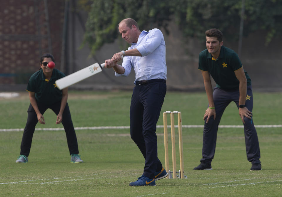 Prince William plays cricket as Pakistani bowler Shaheen Afridi and captain of Pakistani women cricket team Sana Mir look on. Source: AP Photo/B.K. Bangash