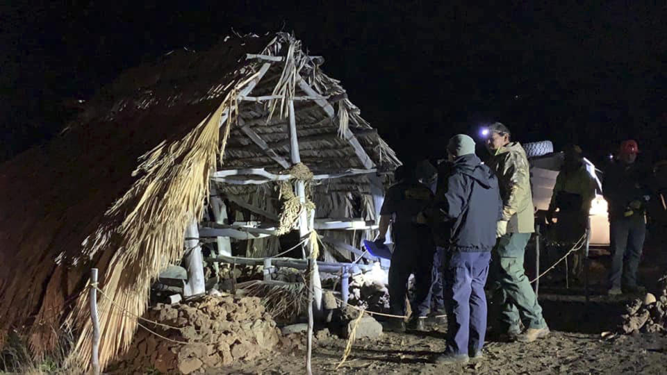 In this photo provided by Pi'ikea Keawekane-Stafford, state and county officials remove Native Hawaiian structures from Mauna Kea, Thursday, June 20, 2019. After years of protests and legal battles, Hawaii officials announced Thursday that a massive telescope which will allow scientists to peer into the most distant reaches of our early universe will be built on a volcano that some consider sacred. The state has issued a "notice to proceed" for the Thirty Meter Telescope project, Gov. David Ige said at a news conference. Ige said four unauthorized structures were removed from the Mauna Kea mountain earlier in the day. (Pi'ikea Keawekane-Stafford via AP)