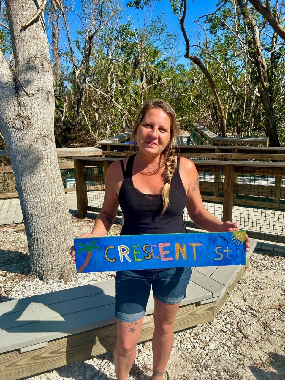 Katrena Young (pictured) and Ryan Jerz started the Ryan & Katrena Crew to put up new, handmade signs on Fort Myers Beach.