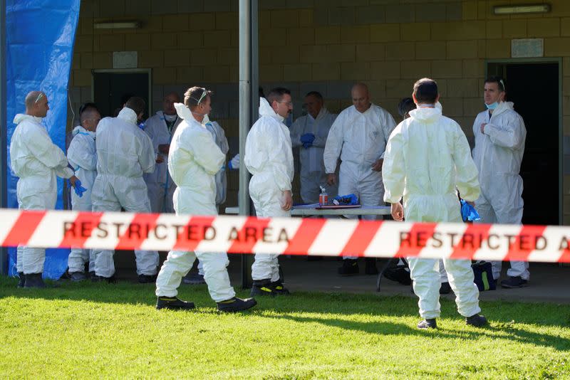 Response personnel prepare to enter a public housing tower, locked down in response to a COVID-19 outbreak, in Melbourne