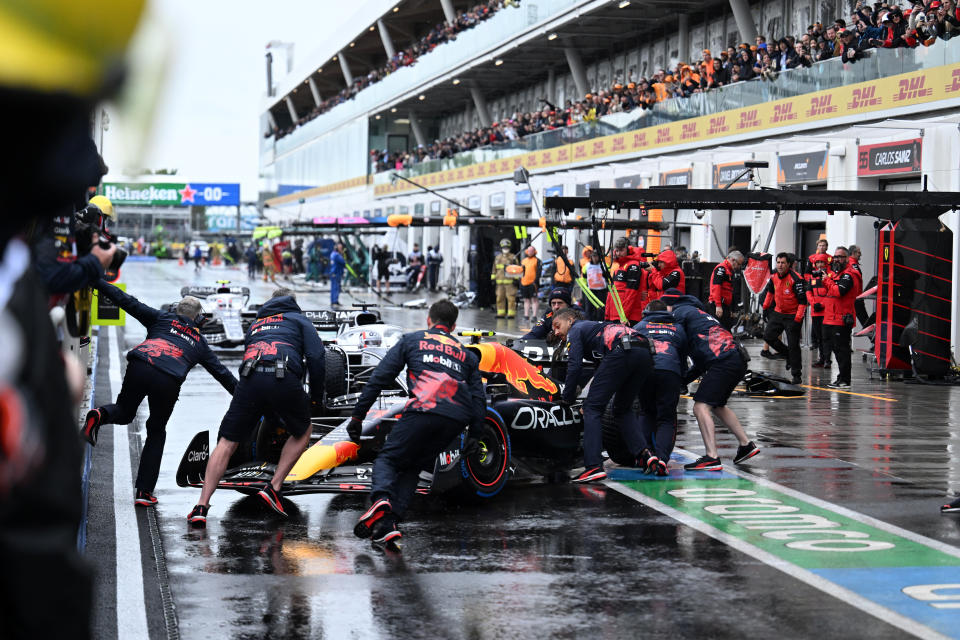 Red Bull driver Sergio Perez, of Spain, is pushed into the garage during qualifying for the Formula One Canadian Grand Prix auto race in Montreal, Saturday, June 18, 2022. (Jim Watson/Pool Photo via AP)