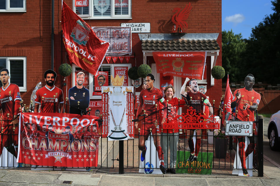 LIVERPOOL, ENGLAND - JUNE 21: Liverpool fan Emily Farley poses outside her home which is decorated in club flags, banners and paraphernalia before the Premier League match between Everton FC and Liverpool FC at Goodison Park on June 21, 2020 in Liverpool, United Kingdom. (Photo by Simon Stacpoole/Offside/Offside via Getty Images)