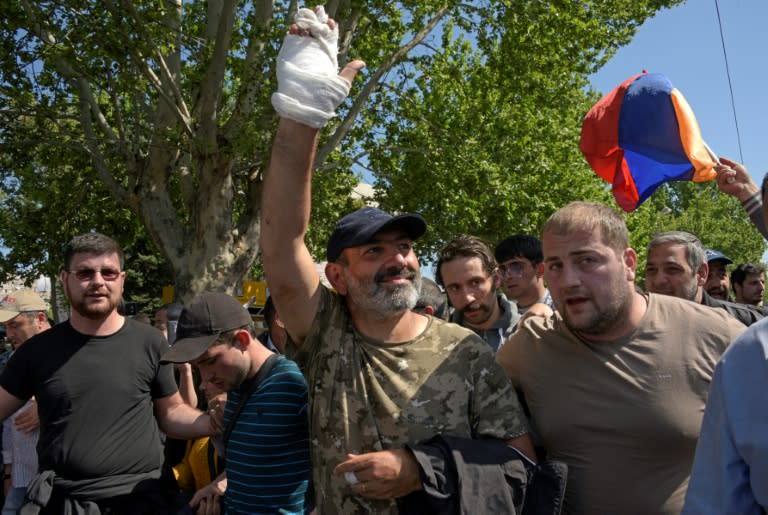 The leader of Armenia's mass anti-government protests Nikol Pashinyan (C) greets supporters after being released from detention. His protest movement led to the resignation of veteran politician, Prime Minister Serzh Sarkisian