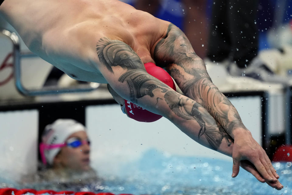 Adam Peaty of Britain starts in the mixed 4x100-meter medley relay heats at the 2020 Summer Olympics, Thursday, July 29, 2021, in Tokyo, Japan. (AP Photo/Matthias Schrader)