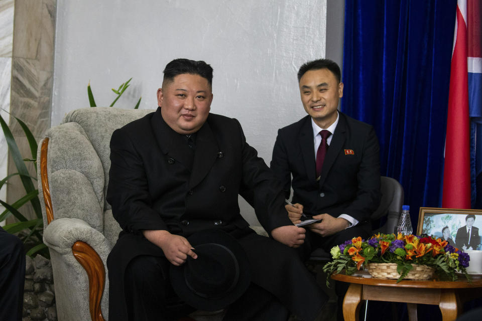 In this photo released by Press office of the administration of Primorsky Krai region, North Korea's leader Kim Jong Un, left, poses for a picture at the border station of Khasan, Primorsky Krai region, Russia, Wednesday, April 24, 2019. North Korean leader Kim Jong Un arrived in Russia on Wednesday morning for his much-anticipated summit with Russian President Vladimir Putin in the Pacific port city of Vladivostok. (Alexander Safronov/Press Office of the Primorye Territory Administration via AP)