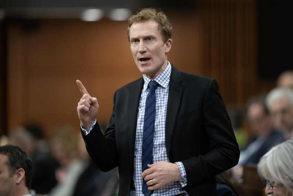 Immigration Minister Marc Miller stands to make a point in Parliament.