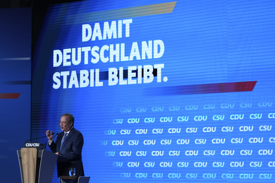 Christian Democrats chancellor candidate Armin Laschet gestures during his speech at a state election campaign in Munich, Germany, Friday, Sept. 24, 2021 two days before the General election on Sunday, Sept. 26, 2021. (AP Photo/Matthias Schrader)