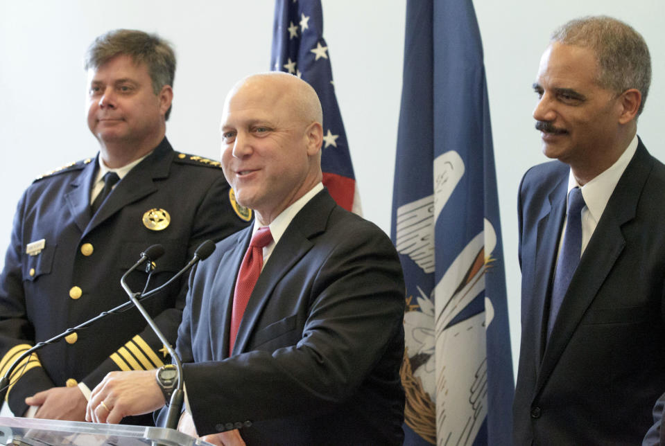 New Orleans Mayor Mitch Landrieu speaks next to Police Superintendent Ronal Serpas, left, and U.S. Attorney General Eric Holder about the details of a federal consent decree from the U.S. Department of Justice that will be used to institute reforms in the New Orleans Police Department inside the historic Gallier Hall, the former New Orleans city hall, in New Orleans, Tuesday, July 24, 2012. (AP Photo/Matthew Hinton)