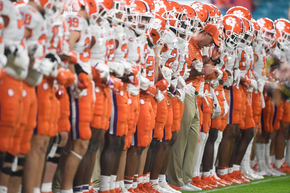 Clemson lines up on the field before the Orange Bowl game between the Tennessee Vols and Clemson Tigers at Hard Rock Stadium in Miami Gardens, Fla. on Friday, Dec. 30, 2022.