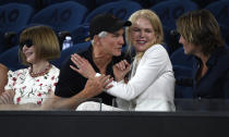 Australian film director Baz Luhrmann talks with Nicole Kidman and her husband Keith Urban, right, as Anna Wintour left, watches during the semifinal between Japan's Naomi Osaka and Karolina Pliskova of the Czech Republic at the Australian Open tennis championships in Melbourne, Australia, Thursday, Jan. 24, 2019. (AP Photo/Andy Brownbill)