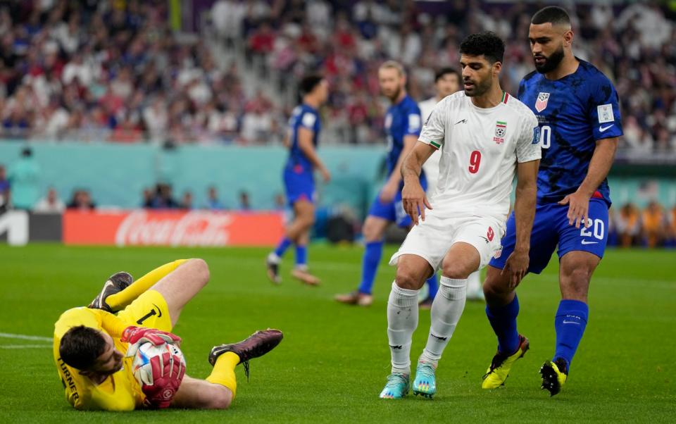 Matt Turner of the United States saves the ball during the World Cup group B soccer match between Iran and the United States - Ricardo Mazalan/Getty Images