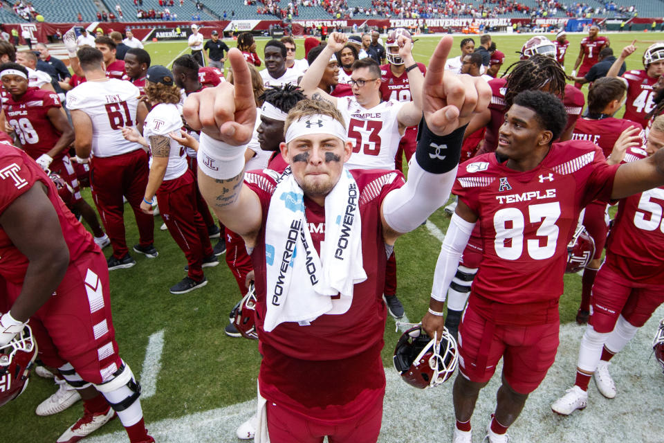 Temple quarterback Anthony Russo (15) celebrates with teammates after their 30-28 win over Memphis in an NCAA college football, Saturday, Oct. 12, 2019, in Philadelphia. T (AP Photo/Chris Szagola)