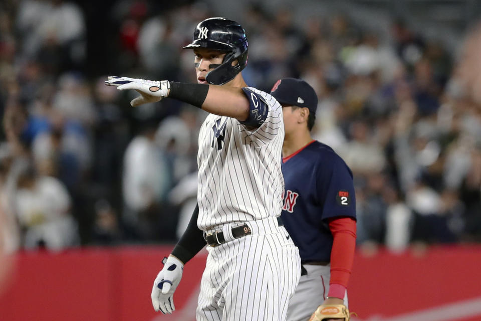 New York Yankees designated hitter Aaron Judge reacts after hitting a double against Boston Red Sox starting pitcher Brayan Bello during the first inning of a baseball game Sunday, Sept. 25, 2022, in New York. (AP Photo/Jessie Alcheh)