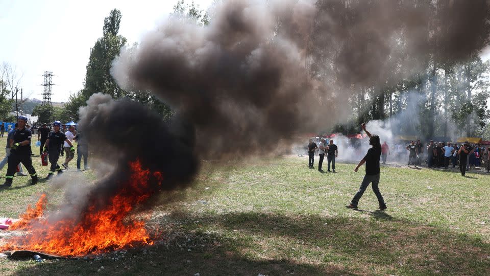 Far-right demonstrators broke through the police cordon and started a fire. - Irakli Gedenidze/Reuters