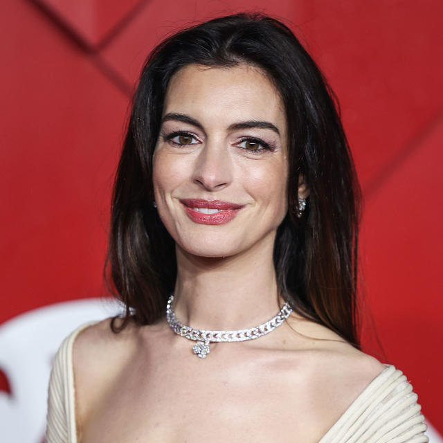 Anne Hathaway Turns Heads In A Dangerously Low-Cut Fringed Gown