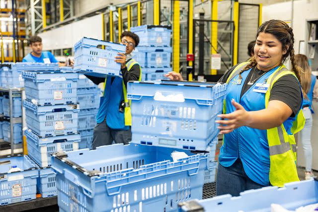 <p>Walmart</p> Walmart employees at the Pleasant Grove Walmart in Rogers, Ark. When associates go into work, they begin their day with a team huddle, they know who they’re working for, what to expect in the day, and they’re given the autonomy to accomplish clear, manageable goals.