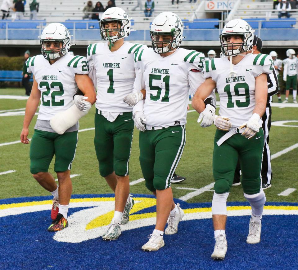 Archmere captains (from left) Cole Fenice, Drew Duncan, John Dellose and Philip Blessington arrive for the pregame coin toss before Caravel's 35-13 win in the DIAA Class 2A championship at Delaware Stadium, Saturday, Dec. 2, 2023.