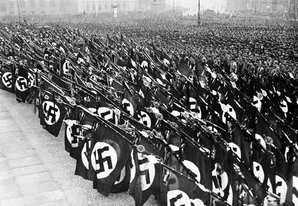 Tens of thousands of Nazi storm troopers take the oath of allegiance to Chancellor Adolf Hitler, in the Lustgarten, Berlin, Feb. 26, 1934. Nazi banners are dipped during the swearing of the oath.