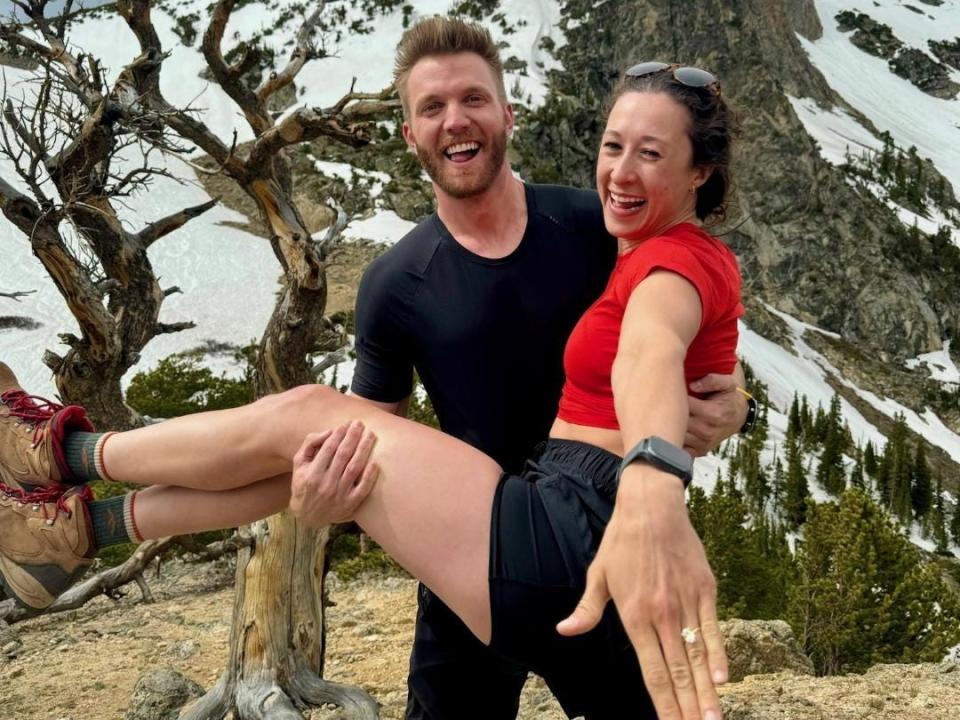 Hayden Boles lifting Aniko Zabo after getting engaged.