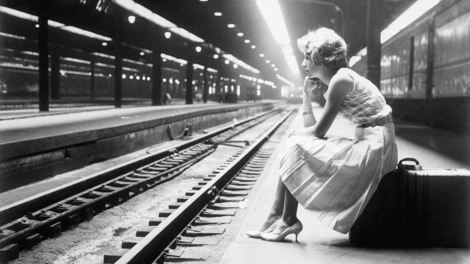 teenage girl waiting for train