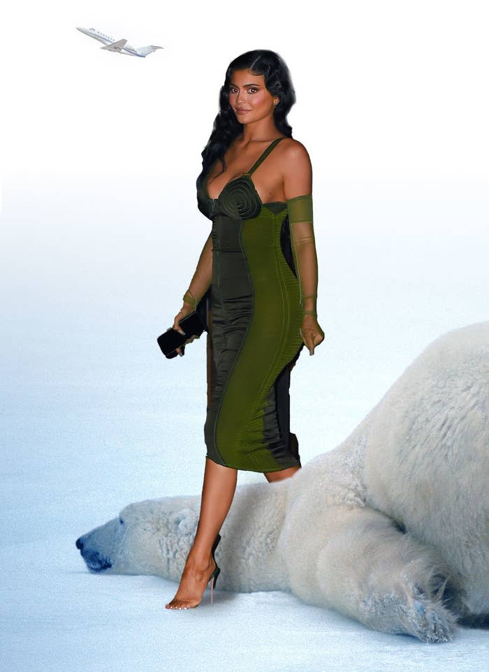 Kylie Jenner steps over a polar bear that's laying on the ground