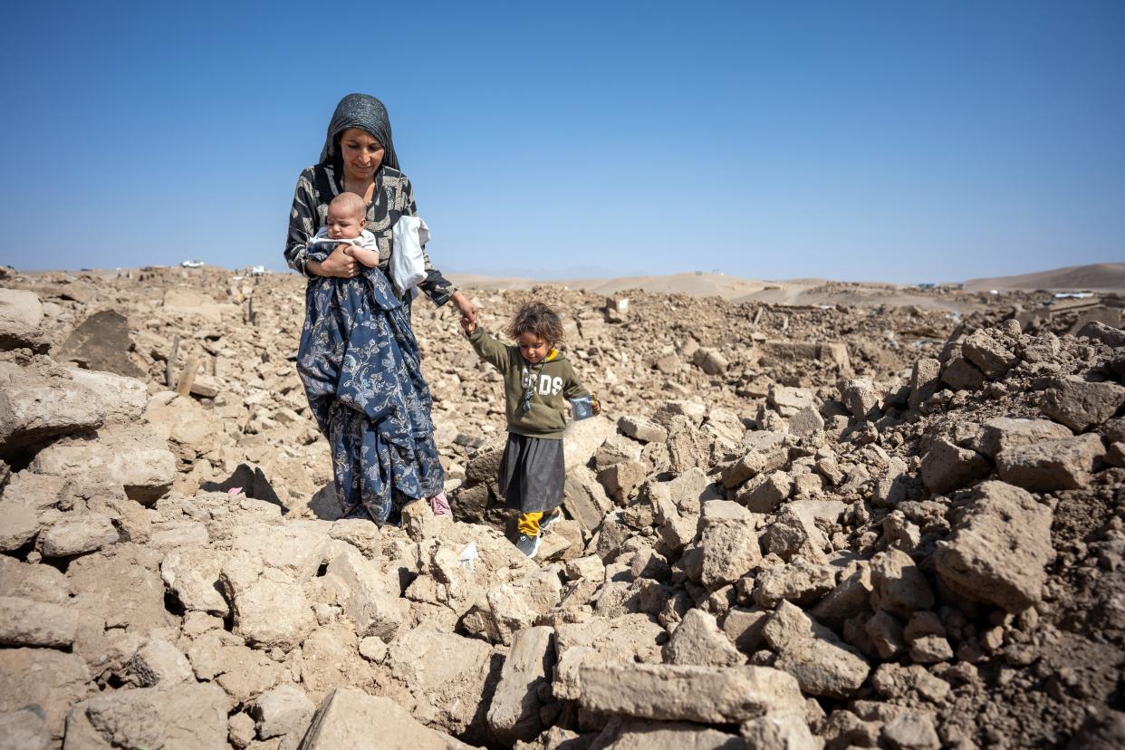 Twenty-five-year-old Hakima walks through her destroyed village with her two children — including her 6-month-old daughter, Nasifa — in Chahak, Injil District, western Afghanistan. According to Hakima: “When the earthquake happened, I was in the city with my husband visiting family. I returned to my village that same night. I couldn’t believe it. It’s so strange and stressful. There was so much dust and we couldn’t find anything. I’m so concerned for Nasifa. We slept rough for two nights with no tents — it was terrible. I have nothing to give Nasifa — it’s a disaster zone here."
