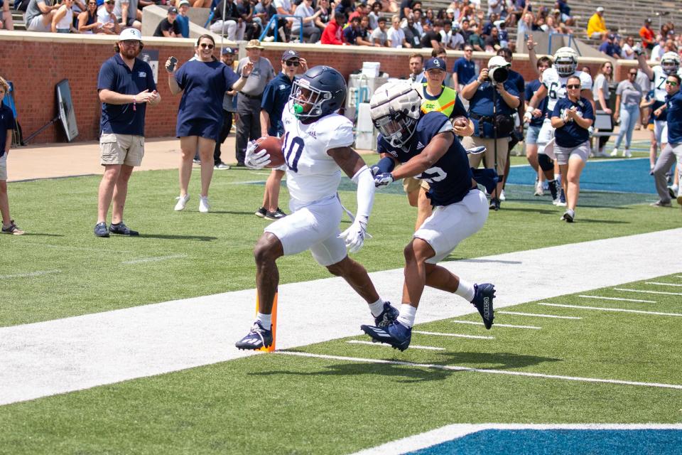 Georgia Southern receiver Darius Lewis (10) scores on a 32-yard touchdown pass from Connor Cigelske during the 2022 Blue-White Spring Game on April 23 at Paulson Stadium in Statesboro.