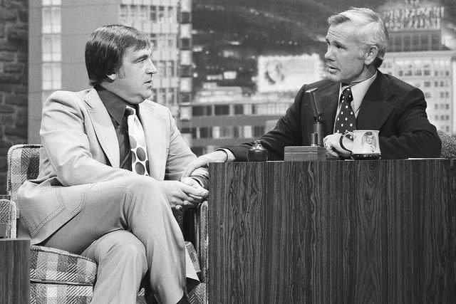 <p>Paul W. Bailey/NBCU Photo Bank/NBCUniversal via Getty</p> Shecky Greene sits with Johnny Carson on Oct. 21, 1975