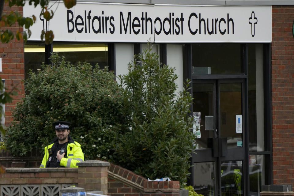 A police officer stands guard by the Belfairs Methodist Church where British lawmaker David Amess was killed Friday during a meeting with constituents, in Leigh-on-Sea, Essex, England, Sunday, Oct. 17, 2021. Amess, a long-serving lawmaker, was attacked during a regular meeting with his constituents at a church in Leigh-on-Sea, a town about 40 miles (62 kilometers) east of London. (AP Photo/Alastair Grant)