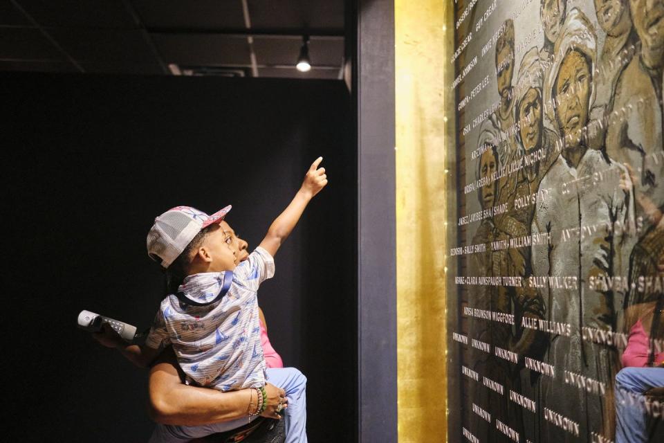 a man writing on a blackboard