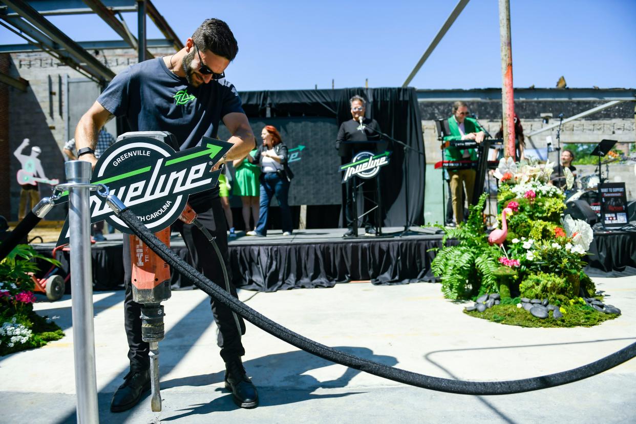 Sam Blumin, chief of staff at Trueline breaks ground on the new music venue using a jackhammer in the West End in Greenville, S.C., on Thursday, April 25, 2024.