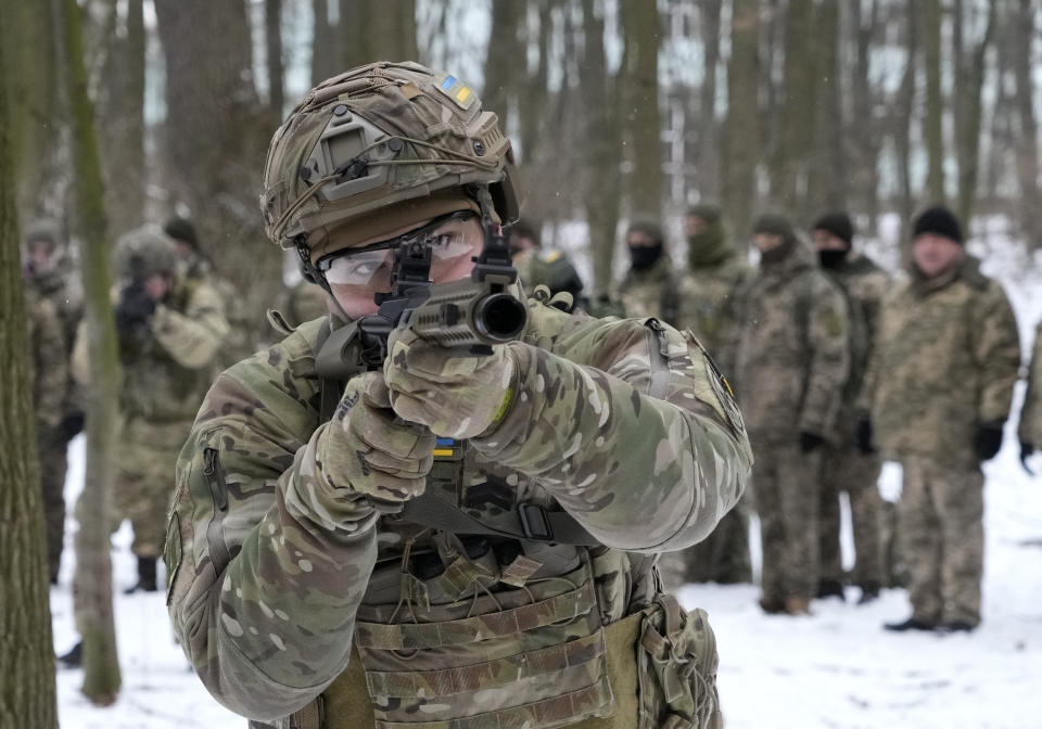 Members of Ukraine's Territorial Defense Forces, volunteer military units of the Armed Forces, train in a city park in Kyiv, Ukraine, Saturday, Jan. 22, 2022. Dozens of civilians have been joining Ukraine's army reserves in recent weeks amid fears about Russian invasion. (AP Photo/Efrem Lukatsky)