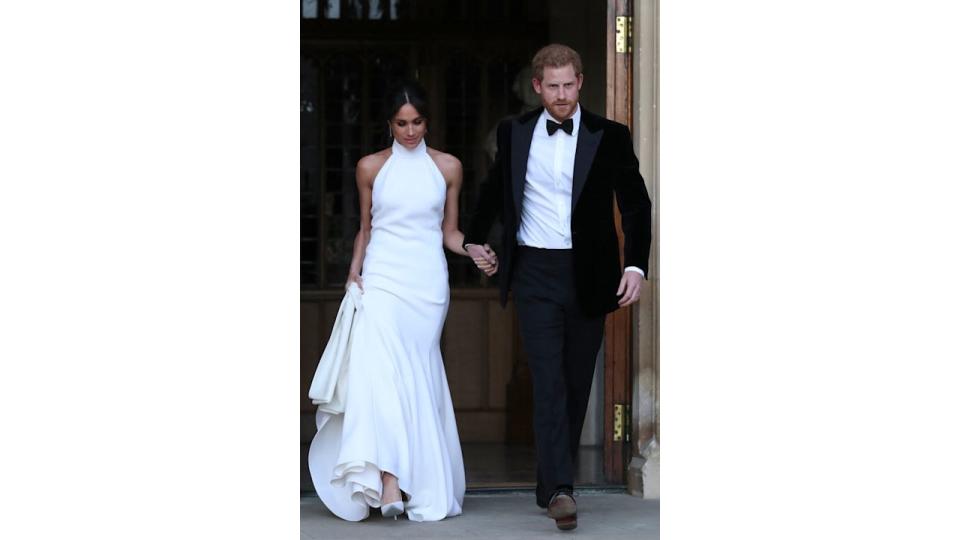 Meghan in halterneck dress with harry in black tie