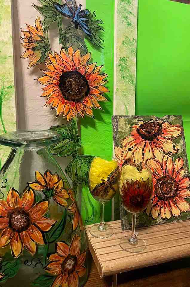 Resident artist Bobbye Edwards has a studio inside Tea & Treasures and customizes ornaments, slate tiles and glassware with her hand painting.