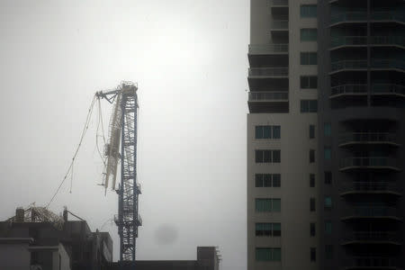 A collapsed construction crane is seen in Downtown Miami as Hurricane Irma arrives at south Florida, September 10, 2017. REUTERS/Carlos Barria