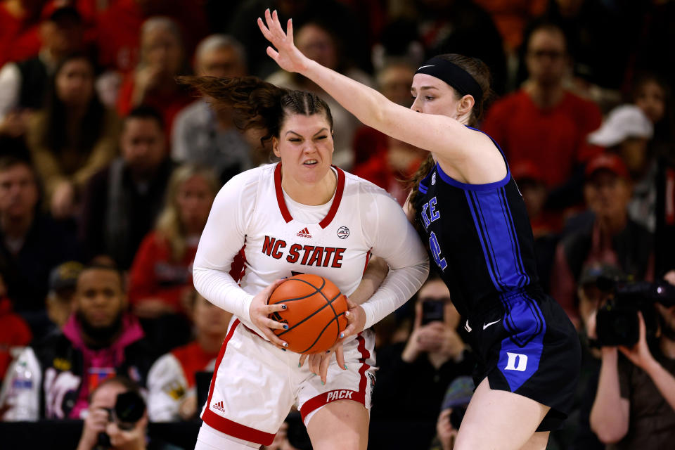 RALEIGH, NORTH CAROLINA - JANUARY 21: River Baldwin #1 of the NC State Wolfpack moves the ball against Kennedy Brown #42 of the Duke Blue Devils during the second half of the game at Reynolds Coliseum on January 21, 2024 in Raleigh, North Carolina. NC State won 72-57. (Photo by Lance King/Getty Images)