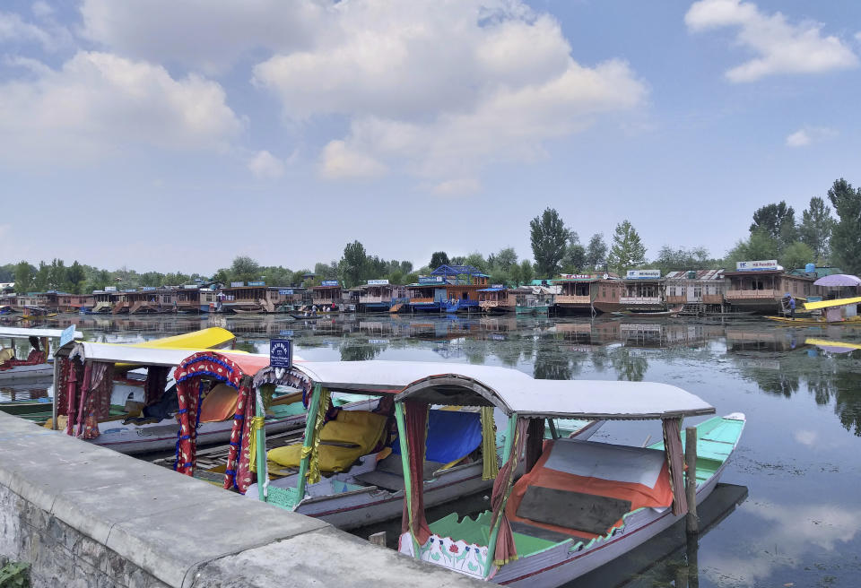 Shikaras, or traditional gondolas, stand parked on the Dal Lake in Srinagar, Indian controlled Kashmir, Thursday, Aug. 8, 2019. The lives of millions in India's only Muslim-majority region have been upended since the latest, and most serious, crackdown followed a decision by New Delhi to revoke the special status of Jammu and Kashmir and downgrade the Himalayan region from statehood to a territory. Kashmir is claimed in full by both India and Pakistan, and rebels have been fighting Indian rule in the portion it administers for decades. (AP Photo/Sheikh Saaliq)