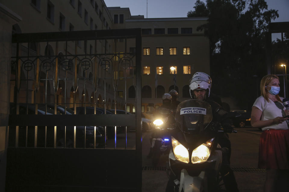 A police officer on a motorcycle exits the Petraki Monastery in Athens, following an attack with a caustic liquid on Wednesday, June 23, 2021. Greek authorities say seven Greek Orthodox bishops have been hospitalized after allegedly being attacked with a caustic liquid by a priest facing a disciplinary hearing in Athens. The incident occurred at a meeting of senior church officials late Wednesday. (AP Photo/Petros Giannakouris)